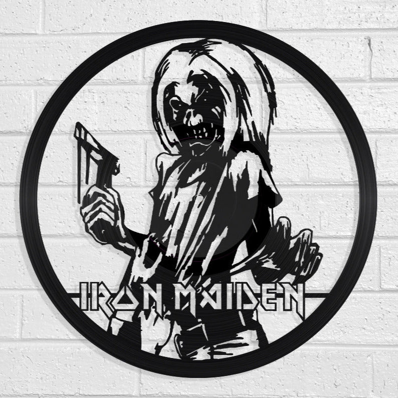 Vinyl LP Record art of Iron Maiden logo with skeleton holding a sword on a white brick wall by Revamped Records
