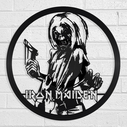 Vinyl LP Record art of Iron Maiden logo with skeleton holding a sword on a white brick wall by Revamped Records