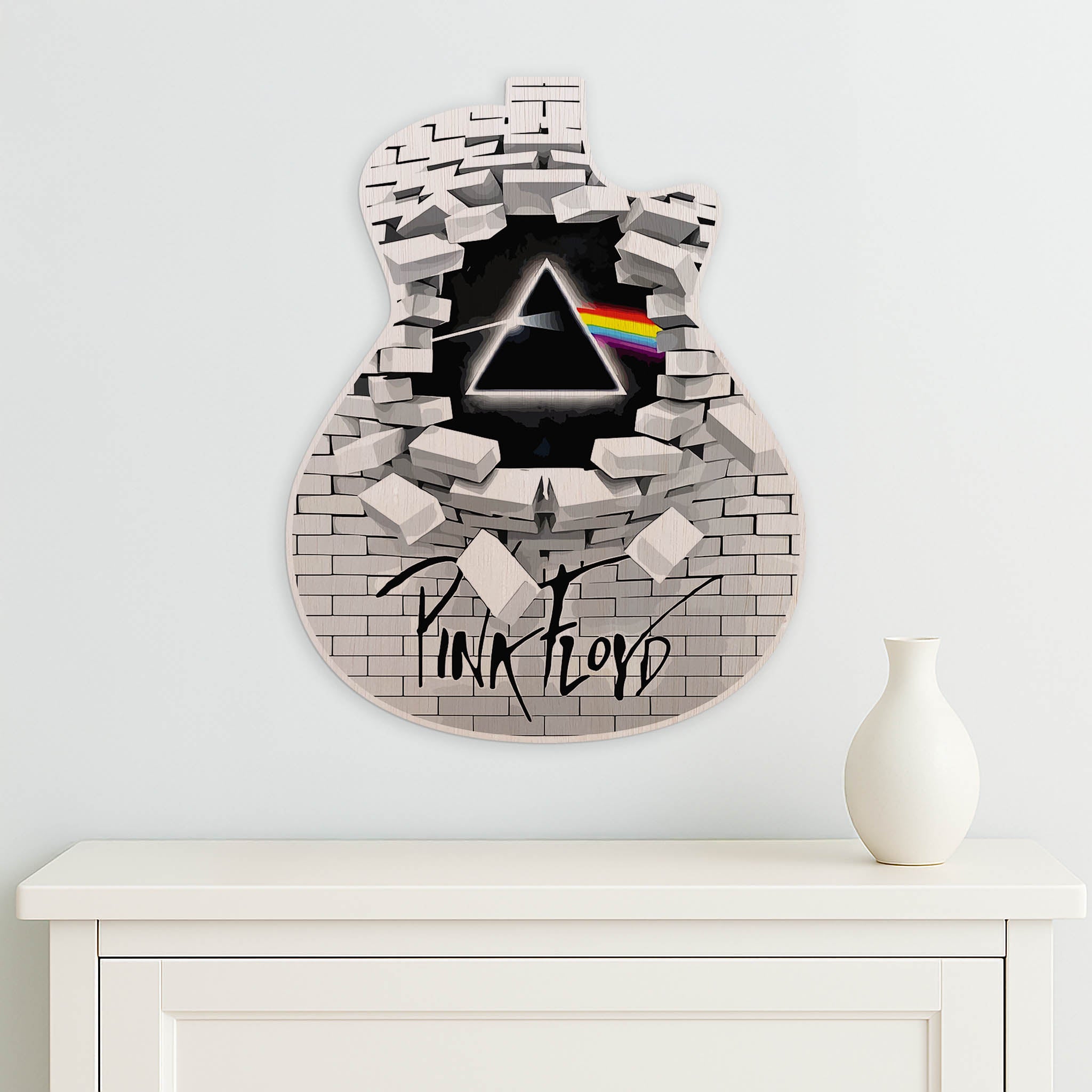 Pink Floyd wall art with a guitar-shaped design on a white background