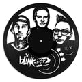 Vinyl record with black and white illustration of three faces and 'blink-182' logo